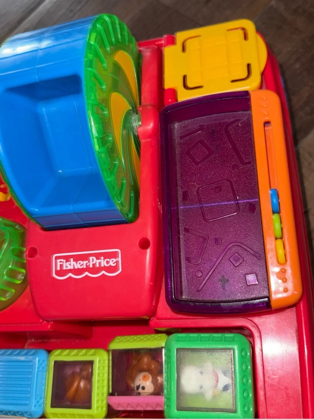 Vintage Fisher-Price Peek-a-boo Pull Toy with Green Handle and Blue Wheels